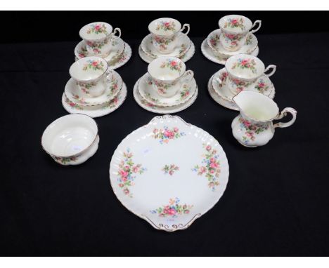 A ROYAL ALBERT 'MOSS ROSE' TEA SET FOR SIX comprising cups, saucers, milk jug, sugar basin, teaplates, and cake plate