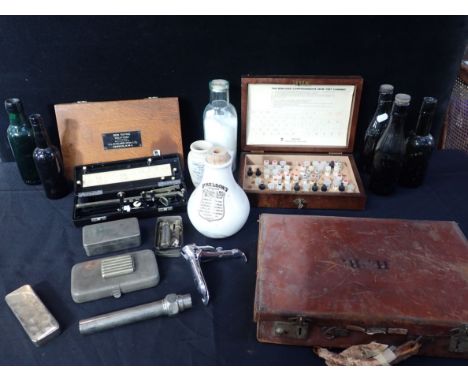 A COLLECTION OF VINTAGE MEDICAL EQUIPMENT and some glass bottles
