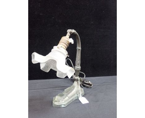 AN EARLY 20TH CENTURY FRENCH DESK LAMP with decoratively cast base and frilled glass shade (for re-wiring