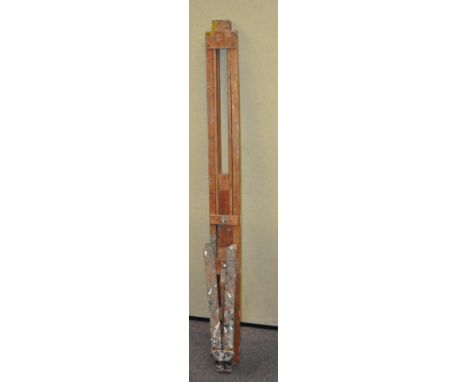 An artist's easel, 158cm long, in current position