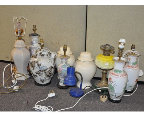 A group of table lamps, mostly ceramic, and including an oil lamp, largest approx 50cm high