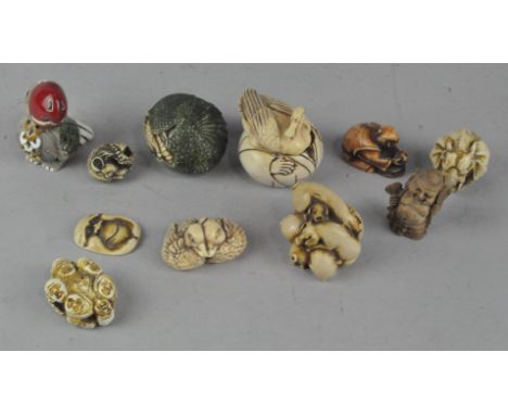 A collection of assorted Oriental netsuke, apparently resin