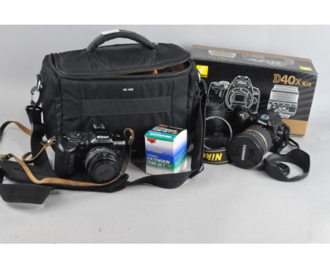 A Nikon D40X digital camera, with numerous lenses including Tamron SP 10-24mm; together with a Nikon F4015 and more