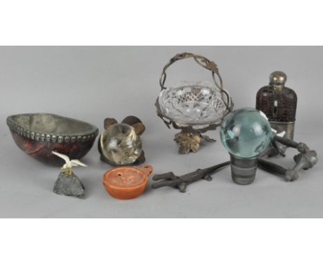 An assortment of collectables, including a hip flask, novelty over-sized thimble and other items