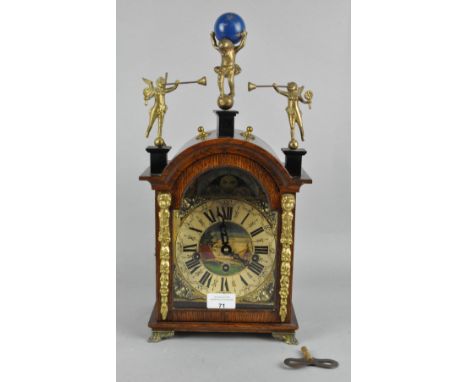 A 20th century oak cased German mantel clock, movement marked FHS, with ornate detailing throughout, 42cm high