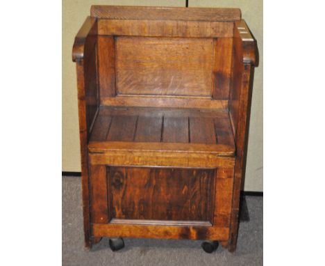 A 20th century oak single seat monks bench/chair, 88cm high x 61cm wide