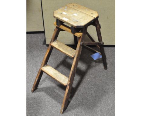 A metamorphic folding stool/step ladder, 65cm high x 27cm wide