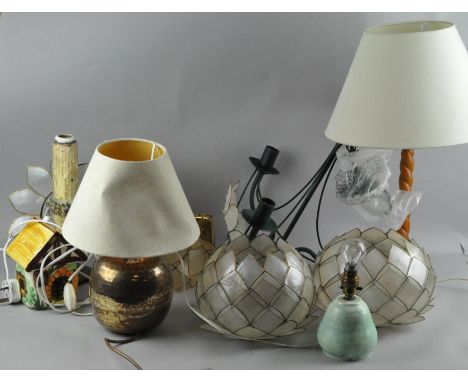 A collection of lighting items including table lamps and a three branch chandelier