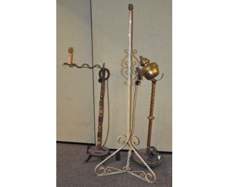A group of three standard lamps, one having previously been an oil lamp, 161cm high