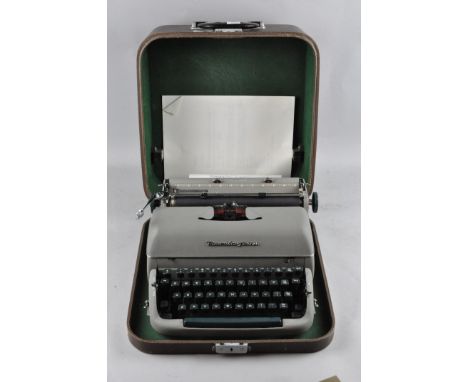 A Remington typewriter, in original case