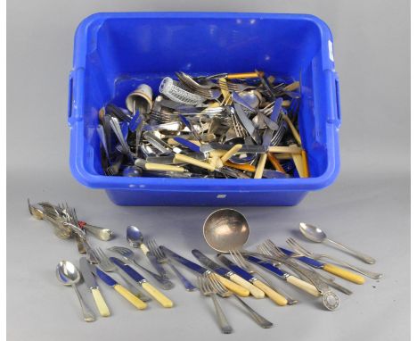 A large assortment of silver plate and other flatware, including butter knives