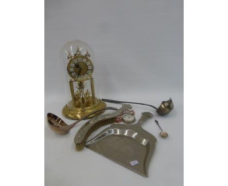 An Art Nouveau brush and comb tray, two ladles, a pocket stopwatch, and a glass domed anniversary clock.