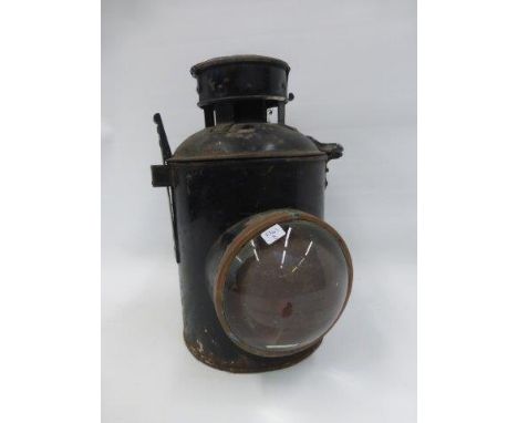 A 19th Century railway lantern with convex lens.