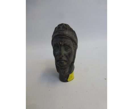 A bronzed walking stick knop in the form of a roman bust.