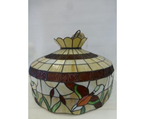 A large leaded stained glass ceiling lamp shade.