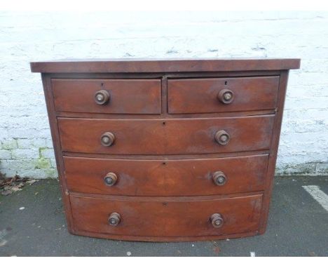 A Victorian mahogany bow fronted chest of two short over three long drawers.