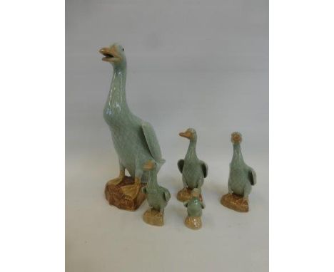 A set of five ceramic glazed ducks.