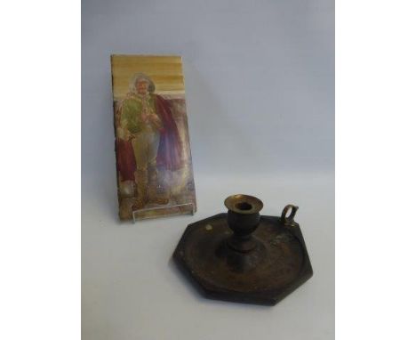 An oak and brass chamber stick, and a 19th Century ceramic fireplace tile depicting a young man with a musical instrument.