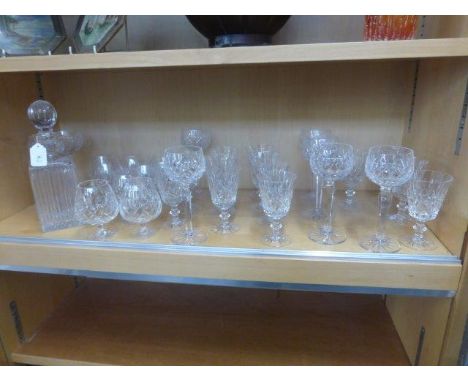 An assortment of drinking glasses and also a decanter.