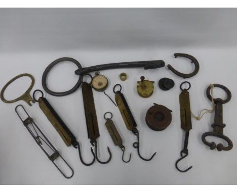 A box of assorted weighing scales, two fishing reels, an iron hook and ring etc.