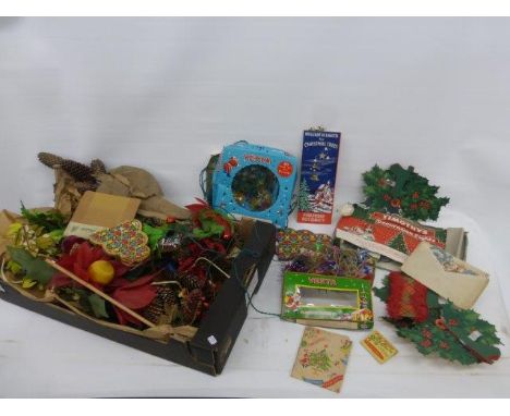 A selection of Christmas decorations including several light sets, paper concertina hanging decorations, a Victorian Christma
