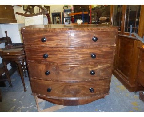 A Victorian mahogany bow fronted chest of two short over three long drawers, raised on bracket supports.