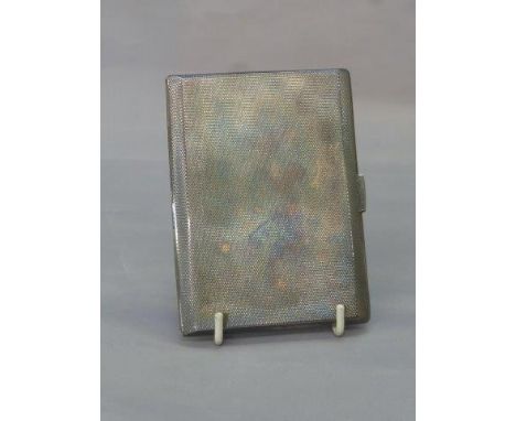 A silver cigarette case with engine turned decoration. Maker F.F. Birmingham 1941.