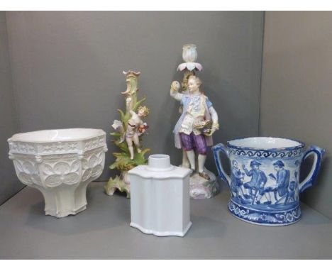 An assortment of Continental and English ceramics including a twin handled blue and white mug with a frog in the well, and a 