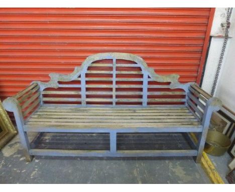 A Lutyens style garden suite, comprising a bench, two elbow chairs and a folding table.