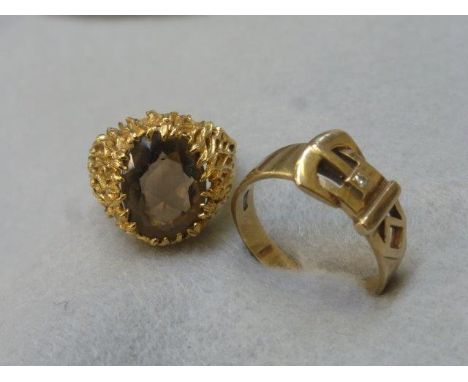 Two 9ct gold rings, one in the form of a belt set with a diamond, size Z+++, and one in a tree bark design set with a citrine