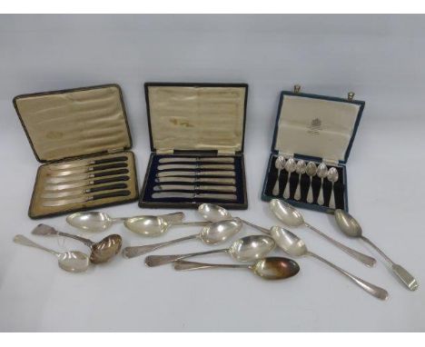 An assortment of silver plated flatware, some with rat tails, and three cased sets of flatware, including a set of silver han