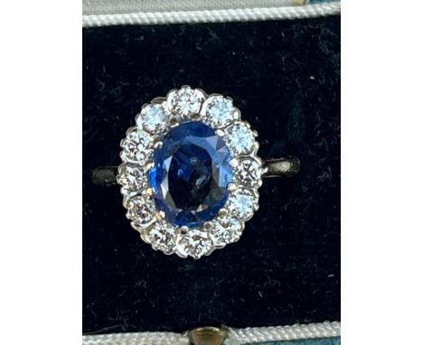 A certified natural 2.68 carat Sri-Lankan sapphire &amp; diamond oval cluster ring, on 18ct gold shank, accompanied by a Gem 