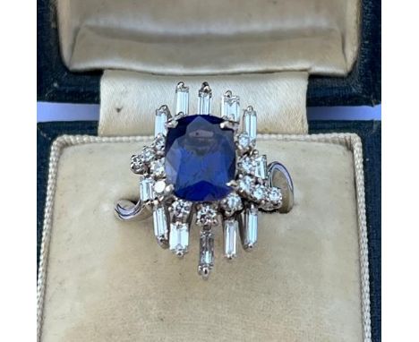 A certified natural 4.24 carat colour change Sri-Lankan sapphire &amp; diamond cluster ring, the four-claw set rectangular cu