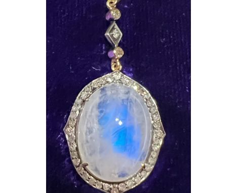 An early 20thC certified natural moonstone (labradorite moonstone) &amp; diamond set pendant , the four-claw set cabochon moo