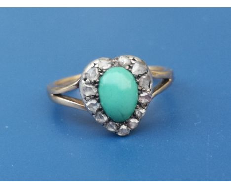 An antique turquoise &amp; rose cut diamond set 18ct gold ring, the oval turquoise within a heart shaped diamond cluster.  Fi