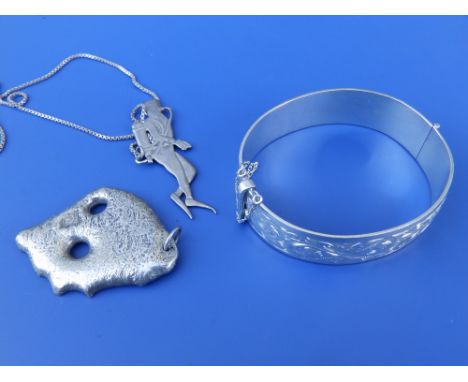 A Red Sea Divers 925 pendant on chain, a modern silver bangle and a free form pendant. (3)