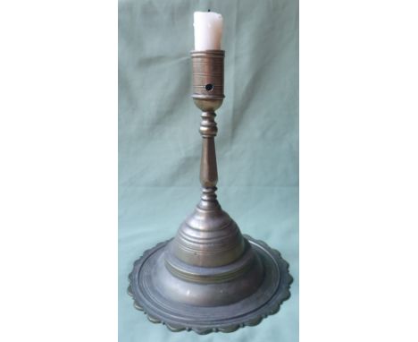 A large antique heavy brass candlestick, 11" high.