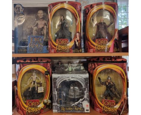 The Lord of the Rings:&nbsp;a collection of boxed and sealed action figures relating to the film series, to include an electr