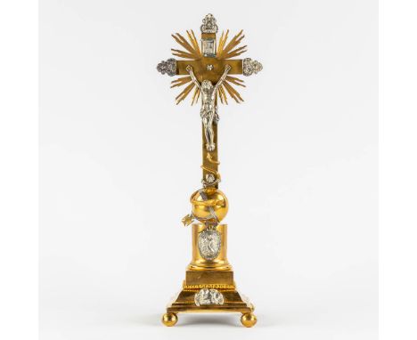 An altar crucifix, silver and brass, richly decorated. 19th century.&nbsp;Richly decorated with a serpent, plaque with mary a