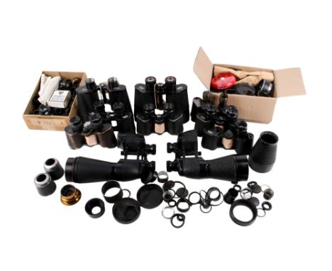 Two boxes of vintage binocular components and spares. Including frames, eyepieces, lenses and more