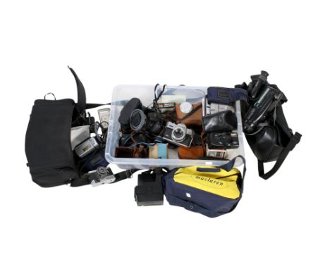 A collection of assorted vintage film and video cameras. Including Samsung, Brownie Model C, Sony, etc, some with cases.