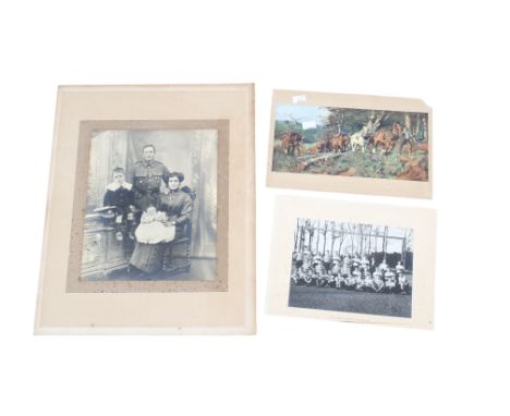 Three vintage black and white photographs. Including a football team, a rugby team and a studio family portrait. Max. 24cm x 