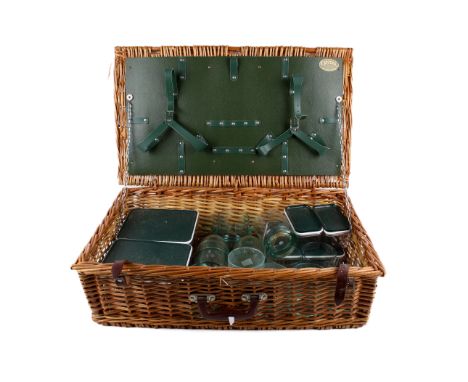 An Optima wicker picnic hamper. Having lidded containers and plastic drinking glasses. H20cm x W65cm x D39cm (AF) Condition R
