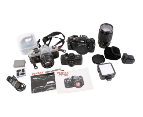 A collection of cameras. Including an Olympus OM20 35mm camera. Olympus Trip 35 Camera, Kodak Box Brownie and a flash attachm