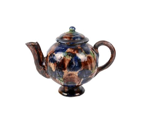 A 19th century Staffordshire Whieldon-type pottery teapot and cover. Having a globular body decorated with a glaze of green, 
