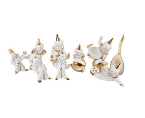 A collection of Limoges and Swarovski figurines. Comprising nine clowns and a lute, max. H17cm