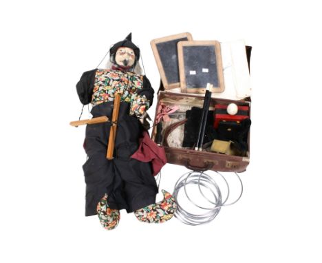 A collection of vintage magic tricks. Including a 'wizard' puppet, two 'magic' wands, etc. 