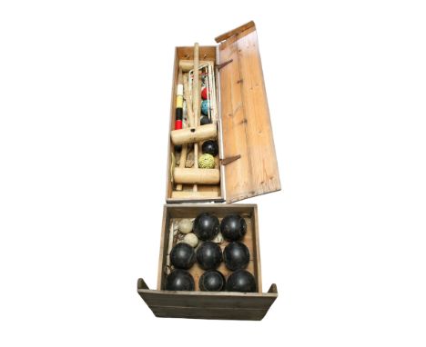 A croquet set and a set of lawn bowls, both in wooden boxes. Including croquet mallets stamped 'Jaques London' and eight bowl