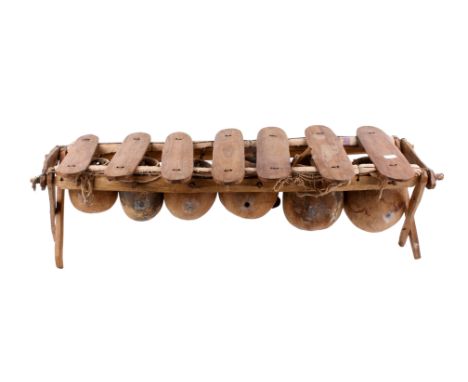 An African tribal 'xylophone'. Hand built with hardwood and gourds. H28cm x W90cm x D31cm