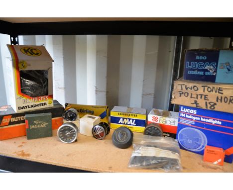 A selection of car instruments with various car parts including Lucas Halogen light and two tone horns.